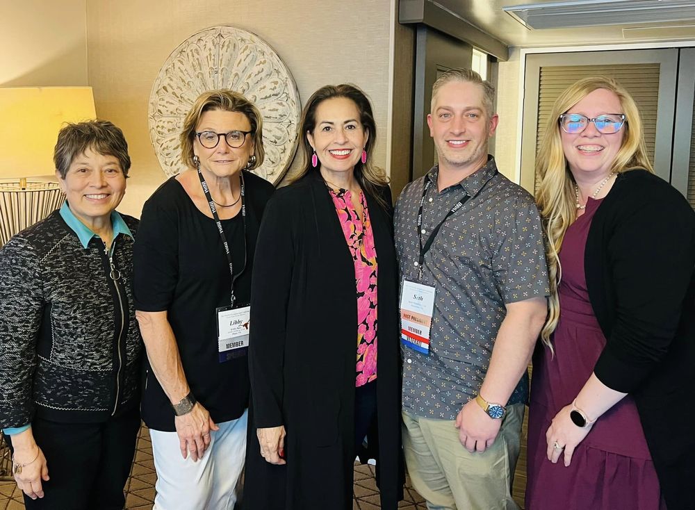 Brandi with social work colleagues at a conference